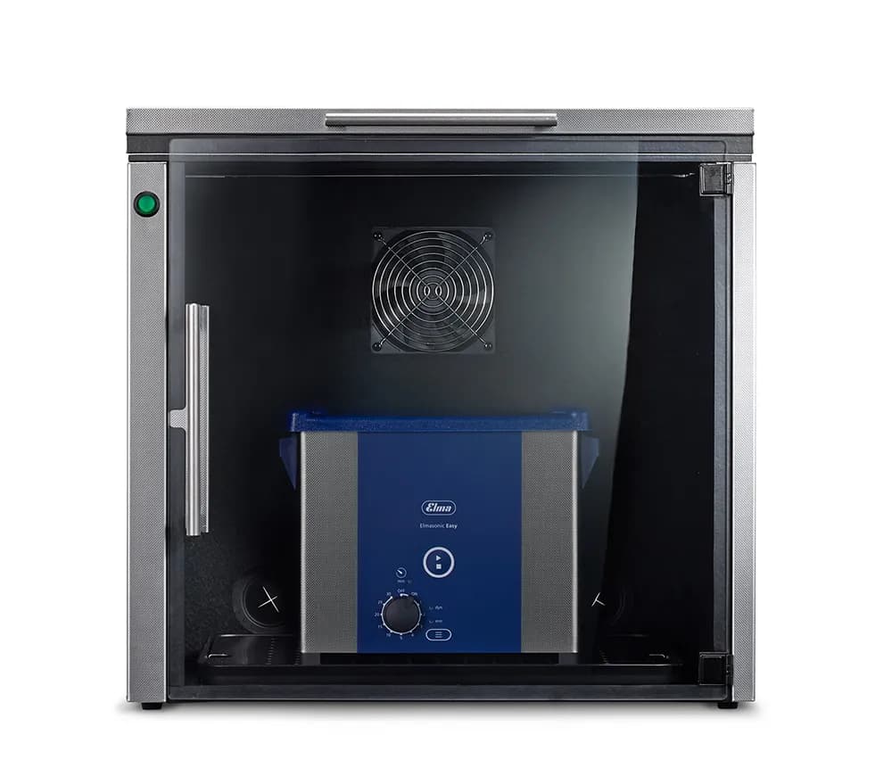 Elma Mutebox ML with blue ultrasonic cleaner inside a glass-fronted enclosure.