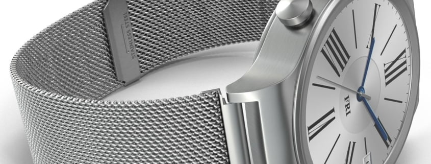 Close-up of a modern silver watch with a mesh metal band on a white background.